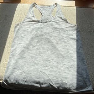 Lululemon tank size 10 grey in color